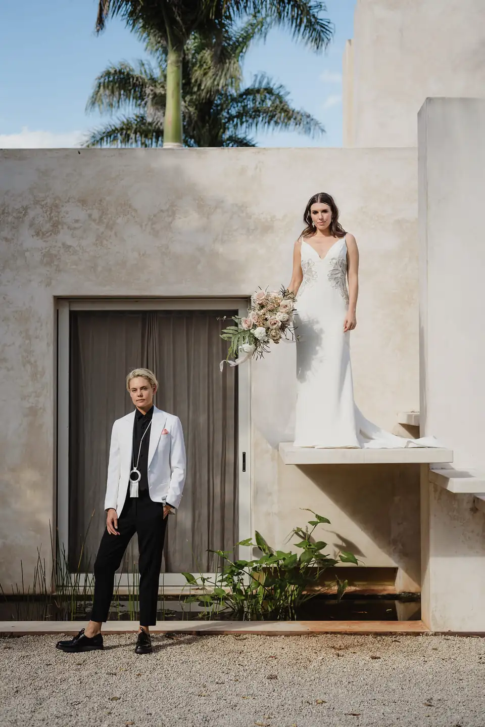Two brides making a modern architectural portrait together