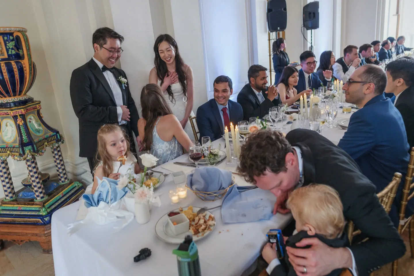 Family and children gathered around a wedding dinner