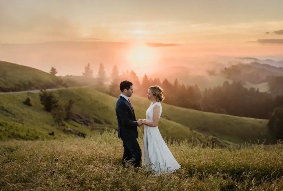 A couple in the green hills of Northern California