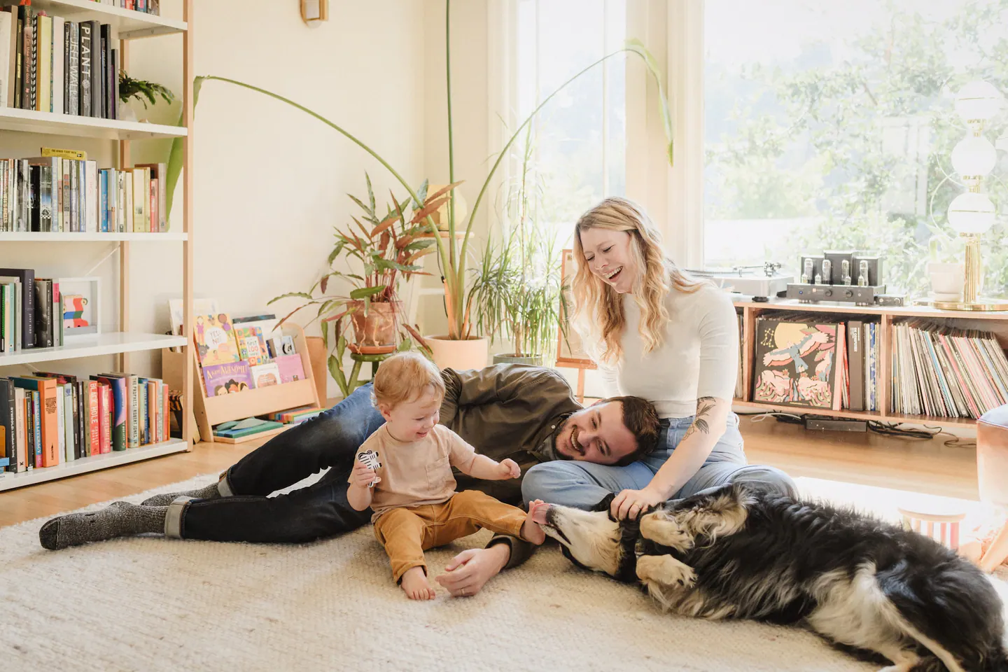 A family relaxing at home with their dogs