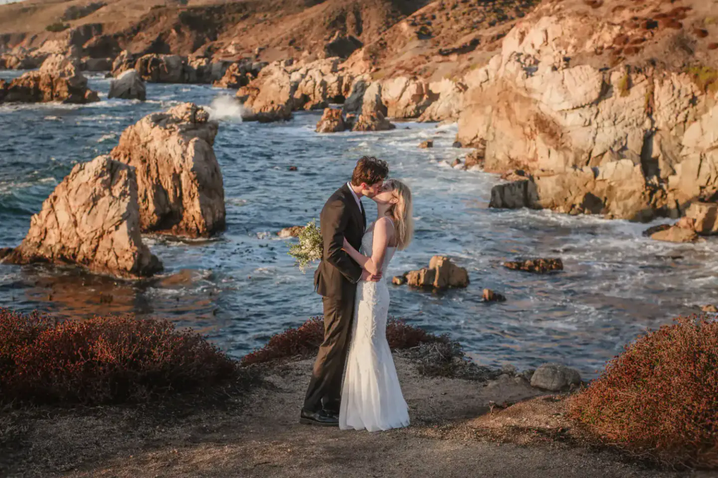 A couple exchanging vows above the Northern California coast