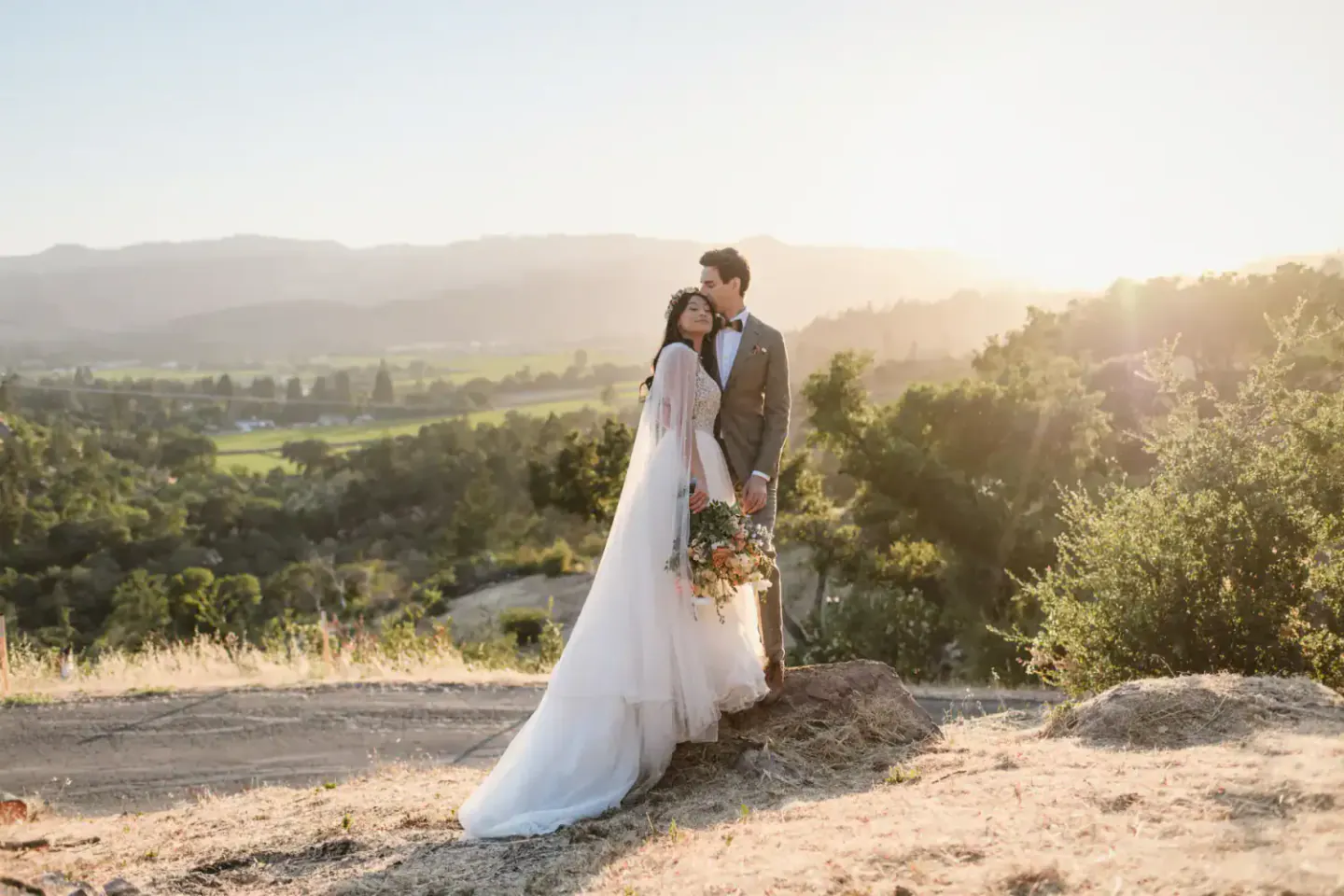 Newlyweds in golden evening light at a private-home wedding in St. Helena