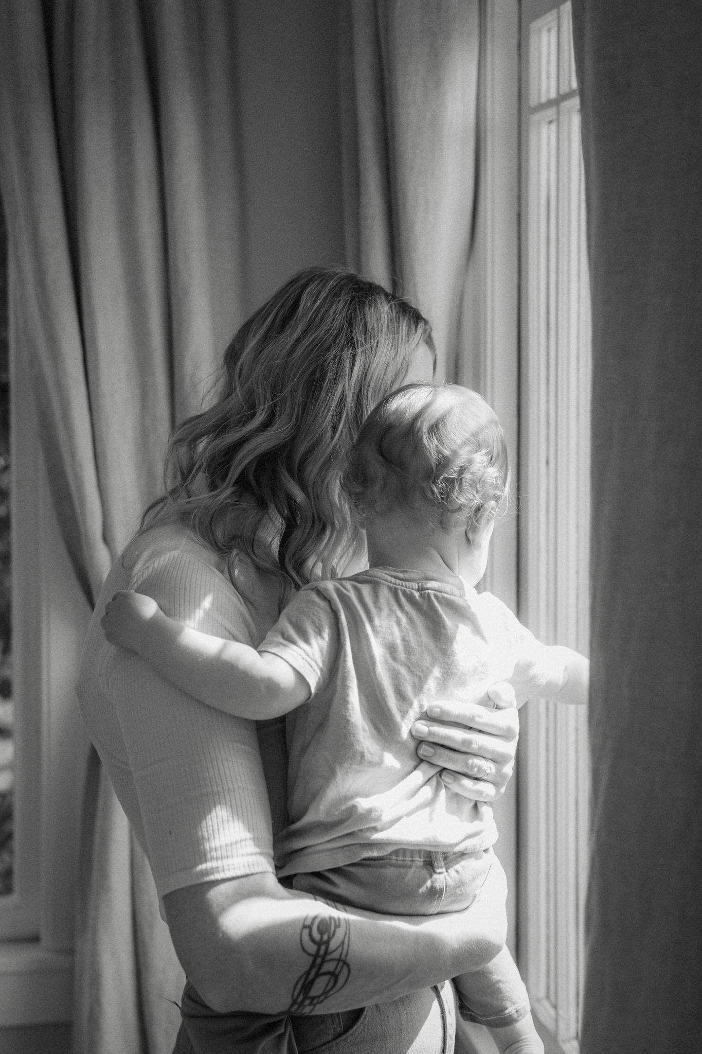 A vertical documentary family portrait filled with movement