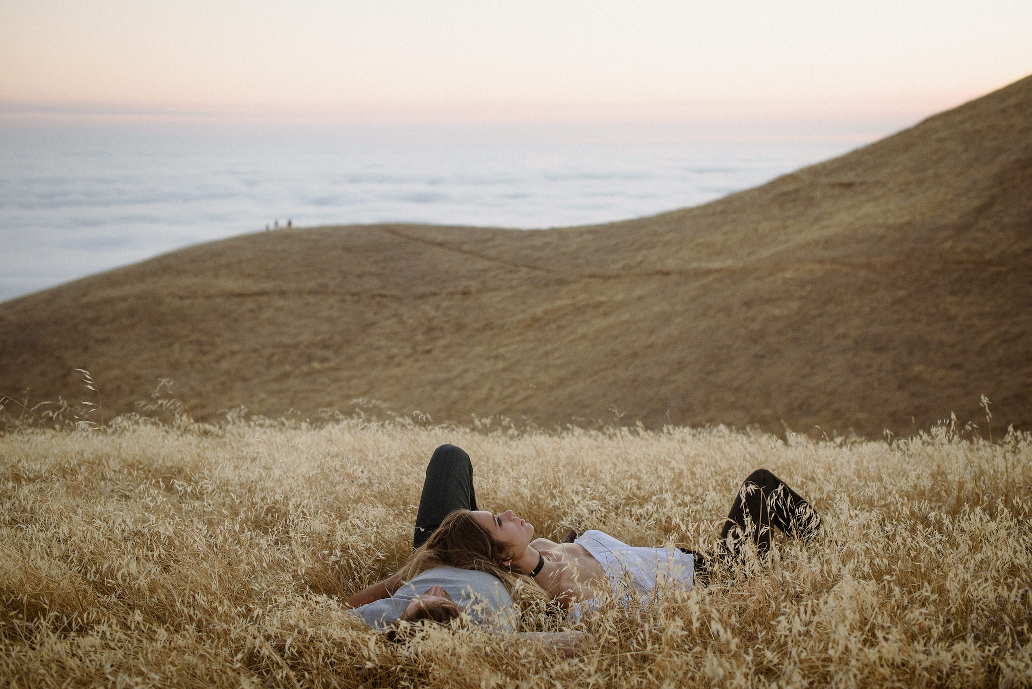 An indoor engagement portrait in soft window light