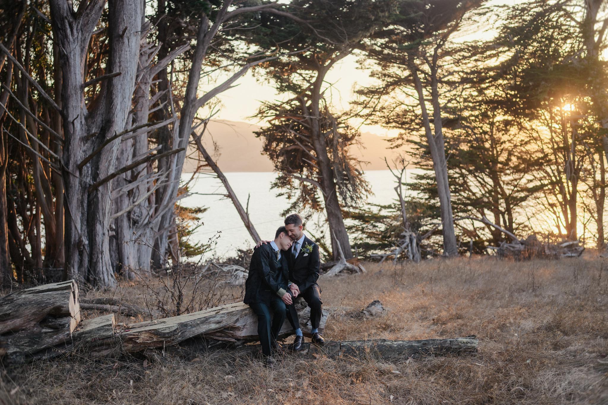 Newlyweds beside a car during a Northern California coastal elopement
