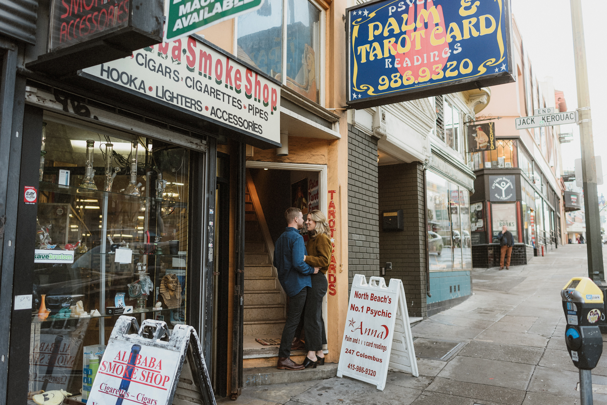 A couple stepping through a colorful San Francisco doorway