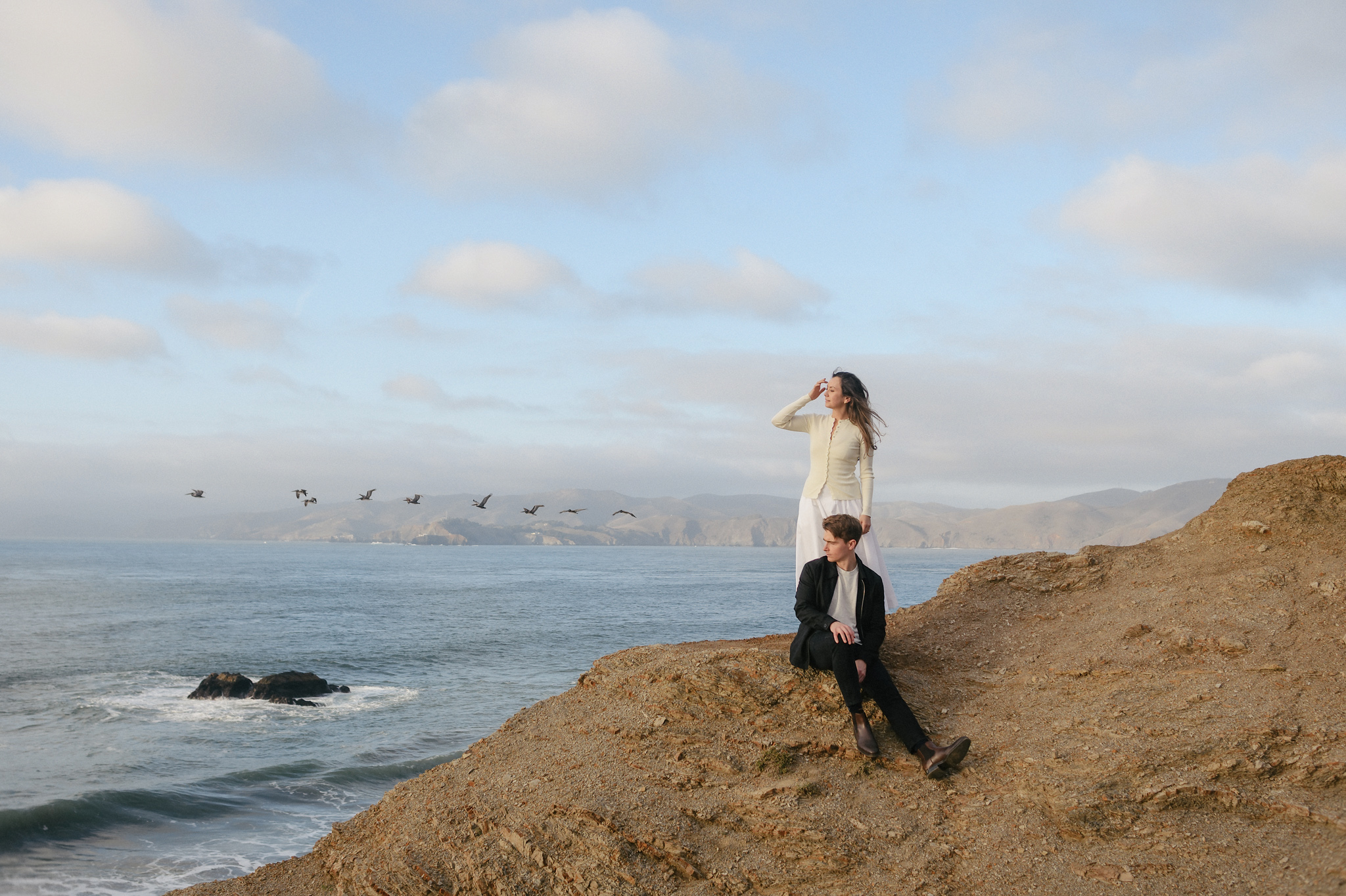 A couple standing together at the water's edge