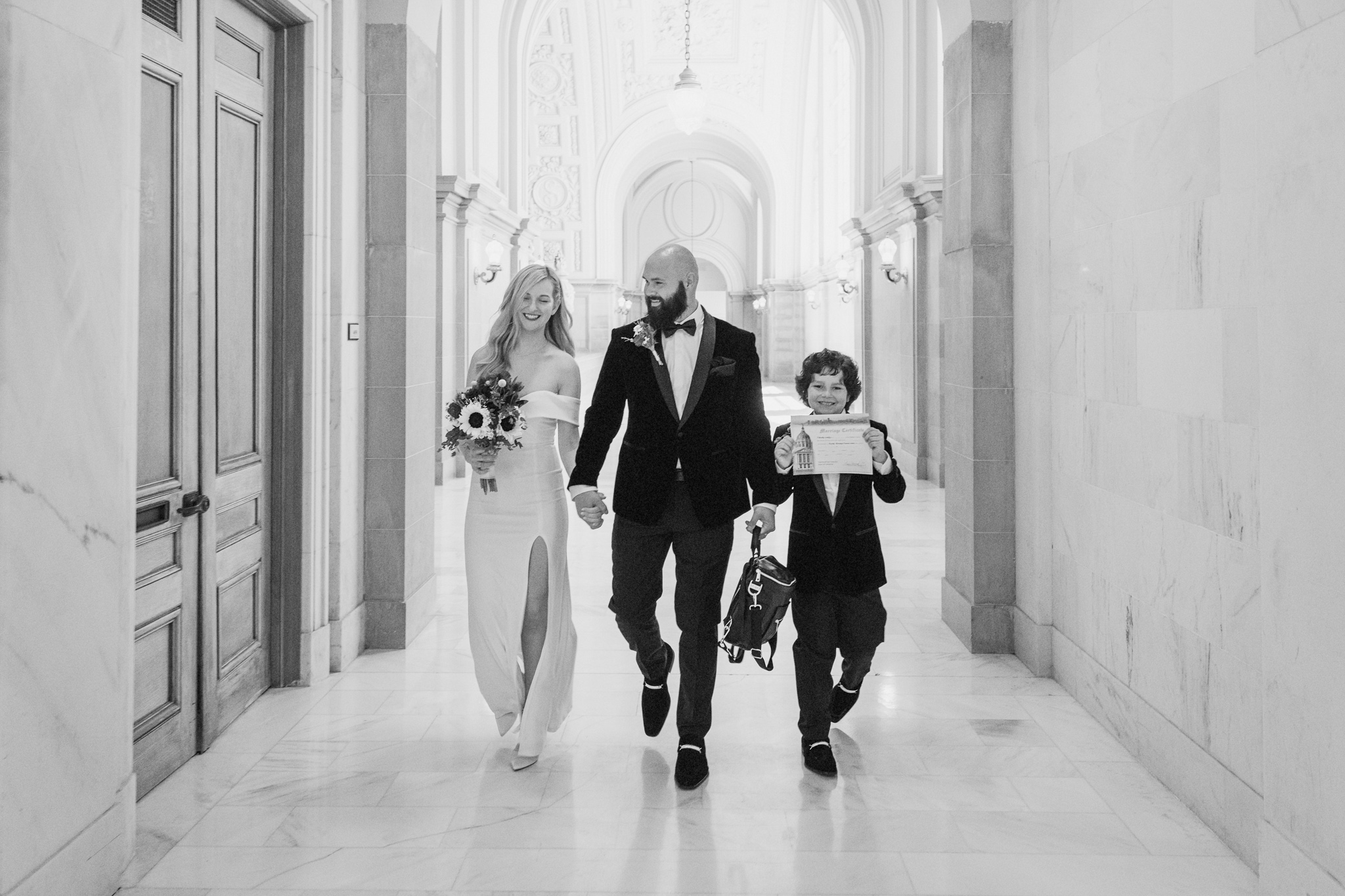 Happy Couple and Child Walking Through SF City Hall