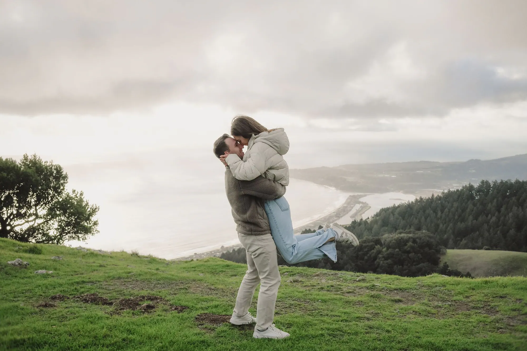 A celebratory embrace on Mount Tam after the proposal