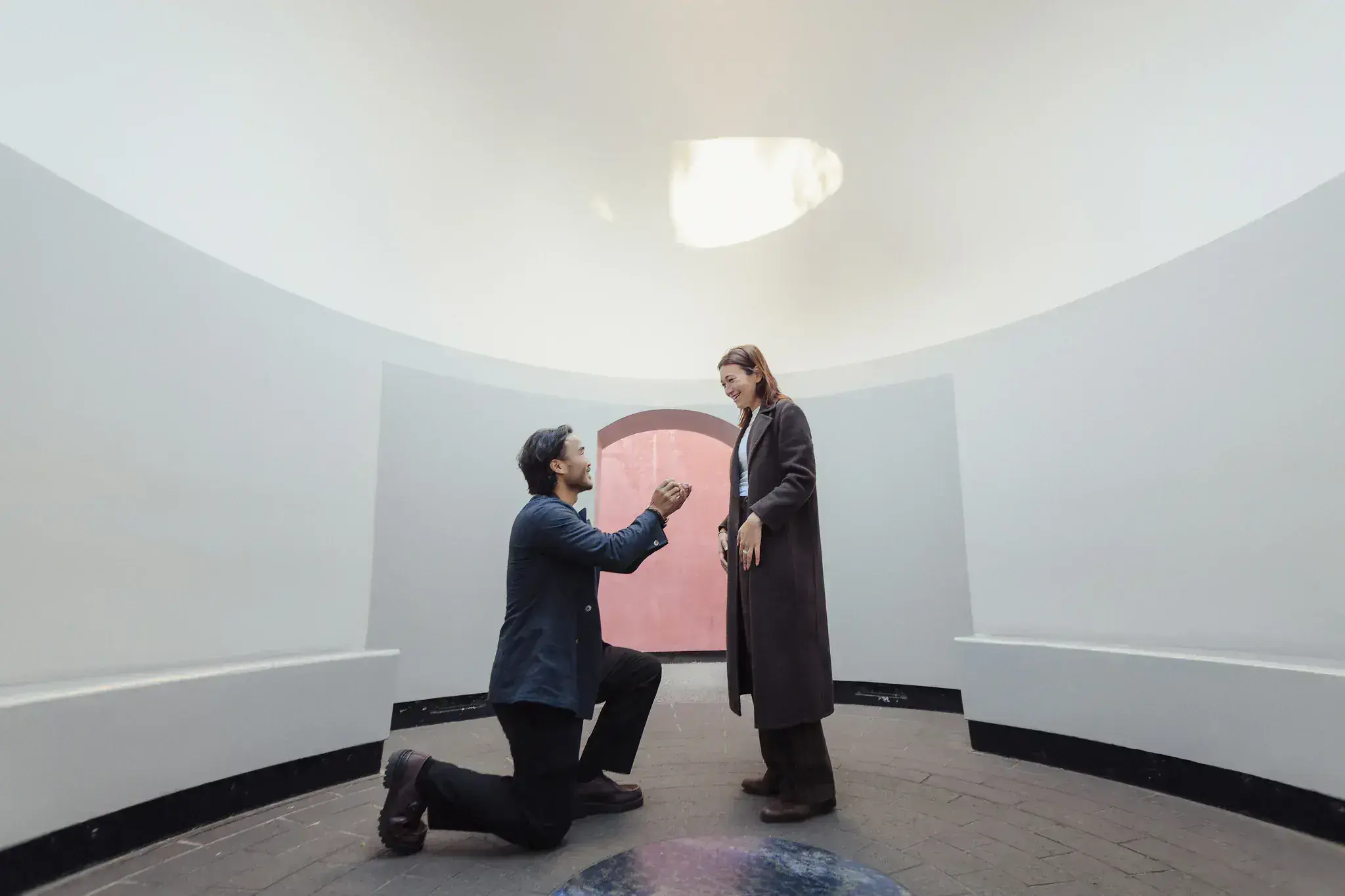 A surprise proposal inside a circular art space in San Francisco
