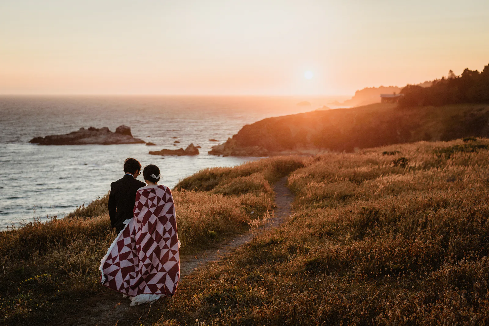 Newlyweds standing in steam on a San Francisco street